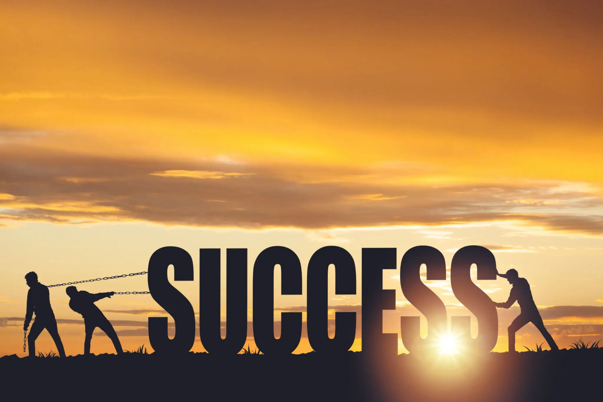 A person is standing in the sun with a word success.
